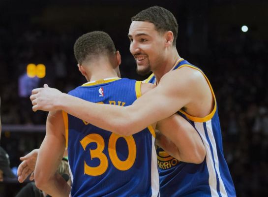 Golden State Warriors guard Klay Thompson hugs