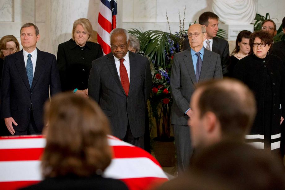 Chief Justice John Roberts Jr. left and from second from left Ginny Thomas next to her husband Justice Clarence Thomas Justice Stephen Breyer and Justice Sonia Sotomayor attend a private ceremony in the Great Hall of the Supreme Court in Washingt