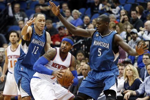 AP DO NOT REUSE
New York Knicks&#039 Carmelo Anthony center is double-teamed by Minnesota Timberwolves&#039 Tayshaun Prince left and Gorgui Dieng of Senegal during the first quarter of an NBA basketball game Saturday Feb. 20 2016 in Minneapoli