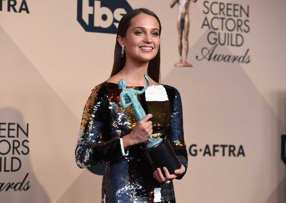 Alicia Vikander accepts the award for outstanding female actor in a supporting role for “The Danish Girl” at the 22nd annual Screen Actors Guild Awards at the Shrine Auditorium & Expo Hall on Saturday Jan. 30 2016 in Los Angeles