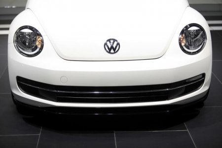 The Volkswagen logo is displayed on a 2014 Beetle TDI during the North American International Auto Show in Detroit Michigan