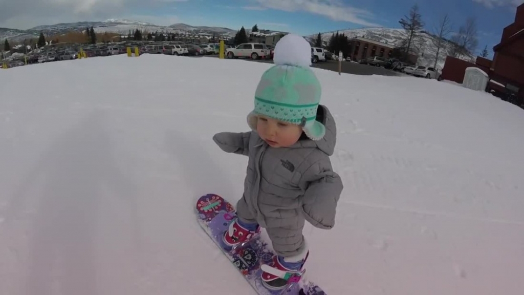 Toddler snowboards like a pro