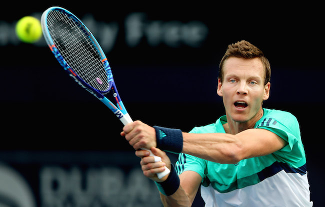 Tomas Berdych from Czech Republic returns the ball to Thomas Fabbiano from Italy during the 3rd day of Dubai Tennis Championships in Dubai United Arab Emirates Wednesday Feb. 24 2016