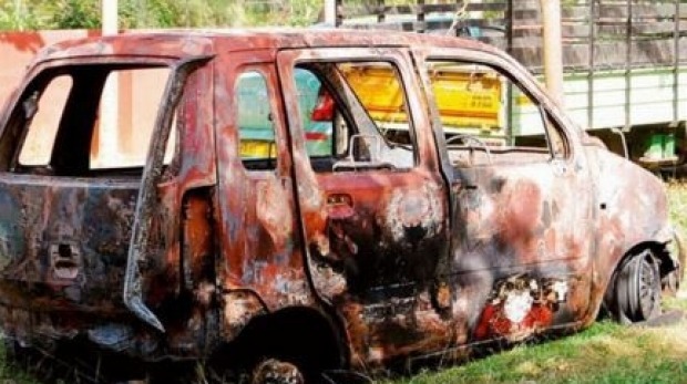 Torched vehicle after riots