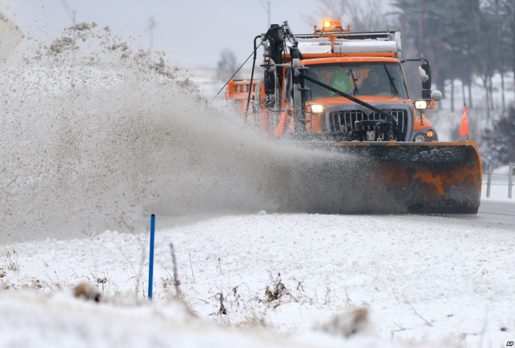 A snowplow clears snow off of Interstate 80 near Earlham Iowa Feb. 2 2016. A winter storm that dumped heavy snow on Denver and much of Colorado has moved east into Nebraska and Iowa