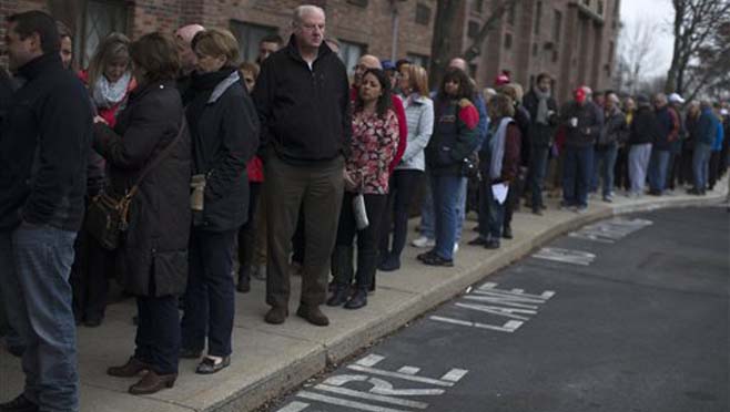 Attendees wait on line before the arrival of Republican presidential candidate Donald Trump ahead of a campaign stop Friday Jan. 29 2016 at the Radisson Hotel in Nashua N.H