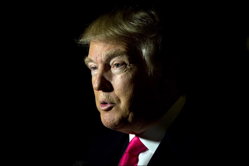 Republican presidential candidate Donald Trump speak with a members of the media Tuesday in Manchester N.H