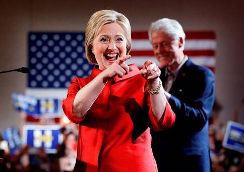 Democratic presidential candidate Hillary Clinton left greets supporters with her husband and former President Bill Clinton at a Nevada Democratic caucus rally