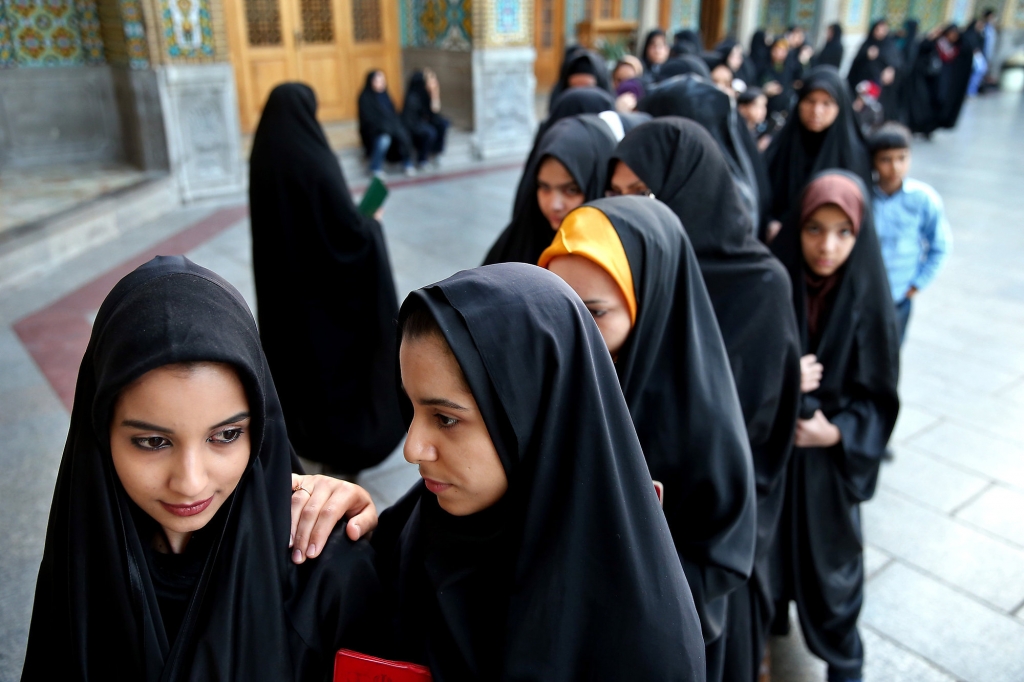 Iranian women stand in line at a polling station during the parliamentary and Experts Assembly elections in Qom 125 kilometers south of the capital Tehran Iran Friday Feb. 26 2016. Iranians across the Islamic Republic voted Friday in the