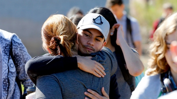 Parents and students reunite Friday after two teens were shot at Independence High School in the Phoenix suburb of Glendale