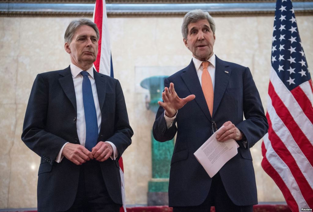 U.S. Secretary of State John Kerry and Britain's Foreign Secretary Philip Hammond address the media at the donors Conference for Syria in London Feb. 4 2016