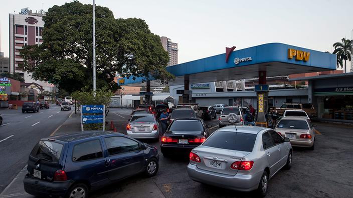 Vehicles queue to stock up on petrol at a Venezuela Oil gas station in Caracas Venezuela 17 February 2016. 
     
    
                   
     
      N