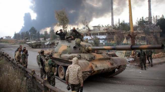 Syrian government forces patrol near Aleppo's thermal power plant after they took control of the area from Islamic State group fighters. AFP