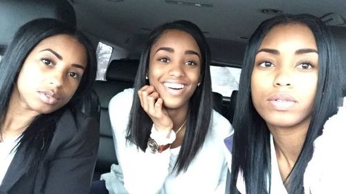 You probably can't tell this mother apart from her twin daughters