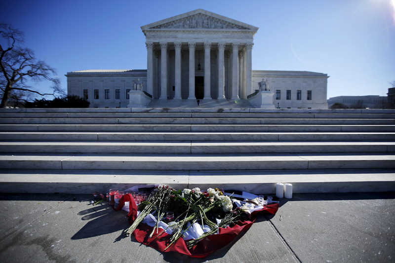 Flowers are seen in front of the Supreme Court building in Washington DC after the death of US Supreme Court Justice Antonin Scalia