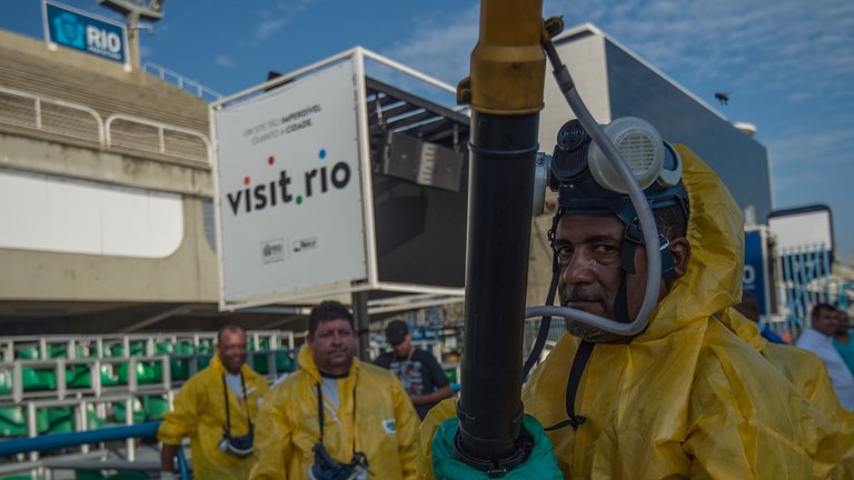 Workers in Rio fumigate in a bid to kill mosquitos which may carry the disease