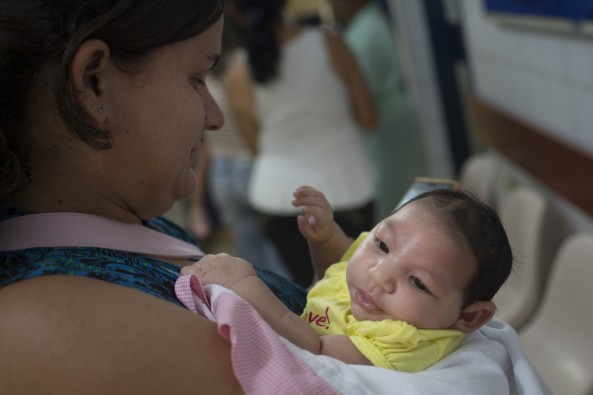 Roseane Alves 31 holds her two-month-old daughter Rackelly Dias at the Oswaldo Cruz Hospital in Recife Brazil on Thursday Jan. 21 2016. Dias was born with microcephaly a brain defect in babies thought to be caused by the Zika virus. The risks from