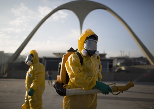 Health workers spray insecticide to combat mosquitoes in Rio de Janeiro