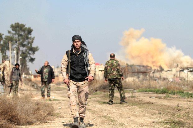 Syrian soldiers on a ravaged street in Daraya
Corbis