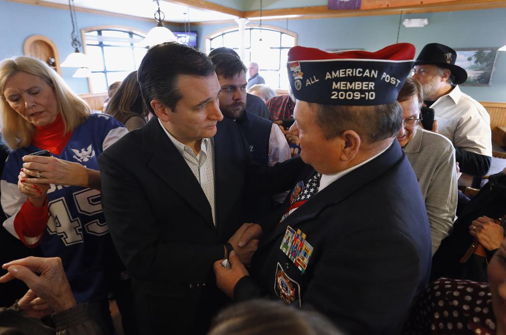 Republican presidential candidate Sen. Ted Cruz R Texas speaks with William Griffin of Charlotte N.C. on Wednesday at the Seneca Family Restaurant in Seneca S.C