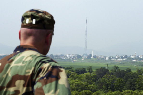 A US soldier looks over North Korea as they stand guard at the check point in the demilitarized South Korea on Aug. 4 2004