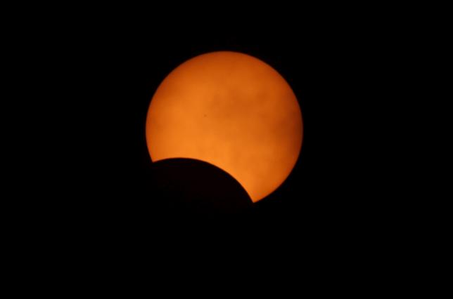 A solar eclipse is seen from Palembang South Sumatra province Indonesia