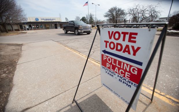 A truck leaves a polling place in Warren Michigan today as Michigan residents vote in their presidential primary