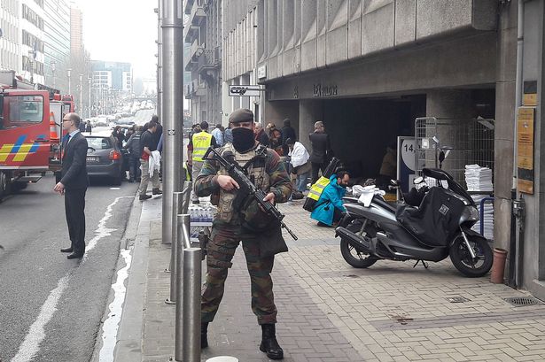 A Belgian soldier stands guard outside the Maalbeek metro station in Brussels