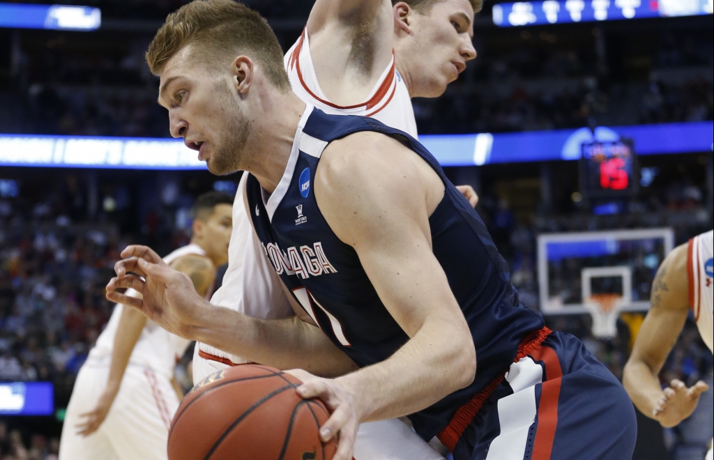 Gonzaga forward Domantas Sabonis front drives past Utah forward Jakob Poeltl during the first half of a second-round men's college basketball game Saturday