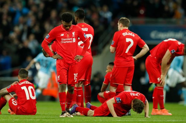 Liverpool players are dejected during the penalty shootout