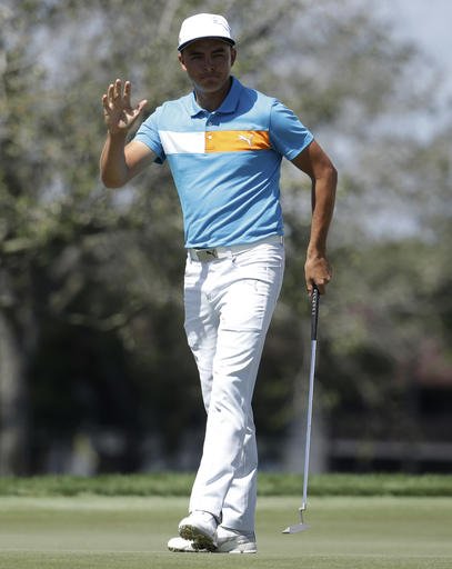 Rickie Fowler waves to the crowd after a birdie putt on the 9th hole during the second round of the Honda Classic golf tournament Friday Feb. 26 2016 in Palm Beach Gardens Fla