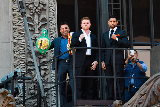 Golden Boy CEO Oscar De La Hoya flanked WBC middleweight champion Saul 'Canelo&#039 Alvarez and Amir Khan to promote their May 7 war at the T Mobile Arena in Las Vegas