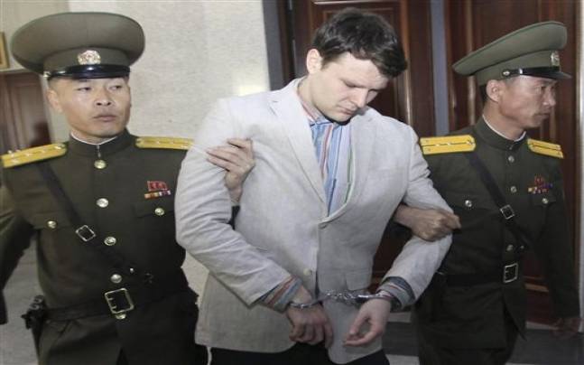 American student Otto Warmbier center arrives at the People's Cultural House as Warmbier is presented to reporters Monday Feb. 29 2016