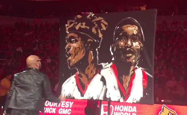 An artist painted a portrait for Louisville's seniors at halftime