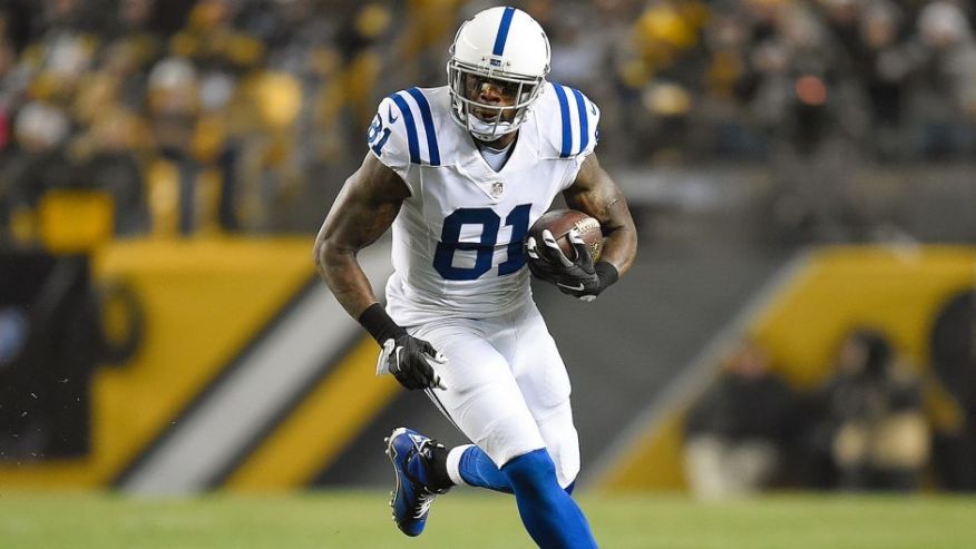 PITTSBURGH PA- DECEMBER 6 Andre Johnson #81 of the Indianapolis Colts carries the ball against the Pittsburgh Steelers at Heinz Field