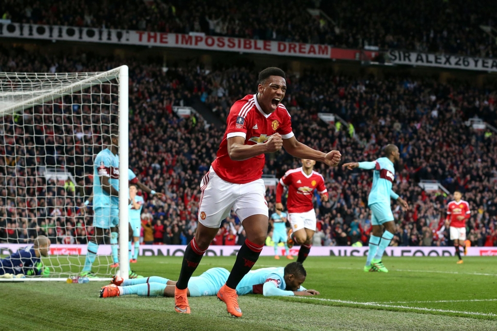 Anthony Martial celebrates his late equaliser for United