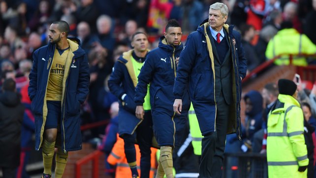 Arsene Wenger heads for the changing rooms after defeat to Manchester United