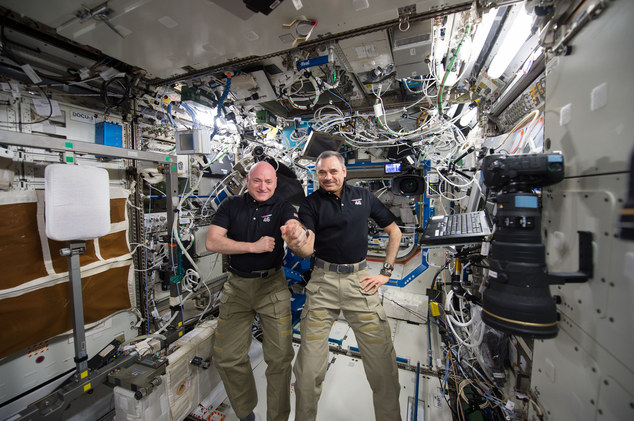 NASA one-year mission crew members Scott Kelly of NASA left and Mikhail Kornienko of Roscosmos their 300th