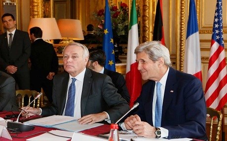 French Foreign Minister Jean Marc Ayrault, and United States Secretary of State John Kerry attend a meeting at the Quai d'Orsay ministry in Paris