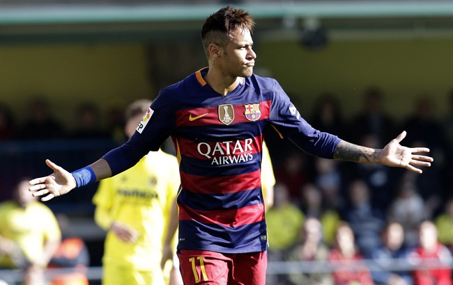 Barcelona's Neymar celebrates after scoring during the Spanish La Liga soccer match between Villarreal and Barcelona at the Madrigal stadium in Villarreal Spain Sunday