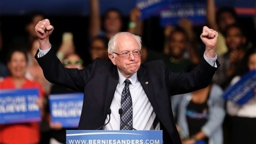 Democratic presidential candidate Sen. Bernie Sanders I-Vt. acknowledges his supporters on arrival at a campaign rally Tuesday