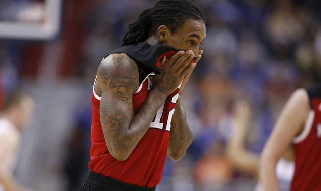 North Carolina State guard Anthony Barber wipes his face during the first half of an NCAA college basketball game in the Atlantic Coast Conference tournament against Duke, Wednesday