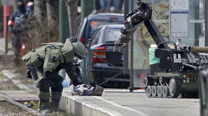 Police conduct more raids in Brussels suburb