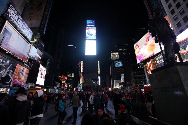 Some buildings in Times Square including One Times Square go dark in observance of Earth Hour Saturday