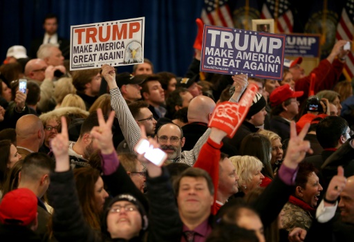 Getty  AFP  File  Joe Raedle. Supporters of Republican presidential candidate Donald Trump wait for results to come in on Primary day at his election night watch party at the Executive Court Banquet facility