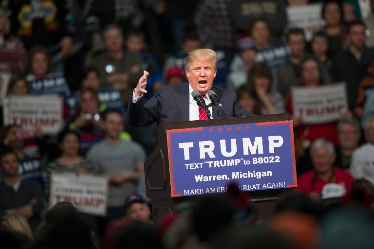 Republican presidential candidate Donald Trump speaks to guests during a rally at Macomb Community College