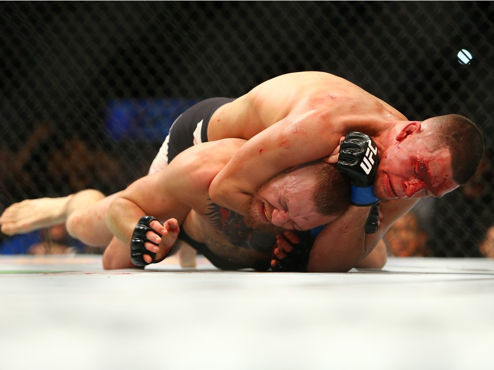 LAS VEGAS NV- MARCH 5  Nate Diaz applies a choke hold to win by submission against Conor Mc Gregor during UFC 196 at the MGM Grand Garden Arena