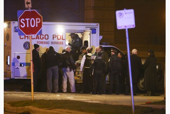 Chicago Police investigate the scene of a shooting in the Homan Square neighborhood in Chicago on March 14. Three officers were shot and one suspect was killed at the scene