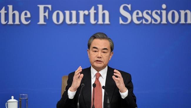 Chinese FM Wang Yi speaks during a press conference in Beijing