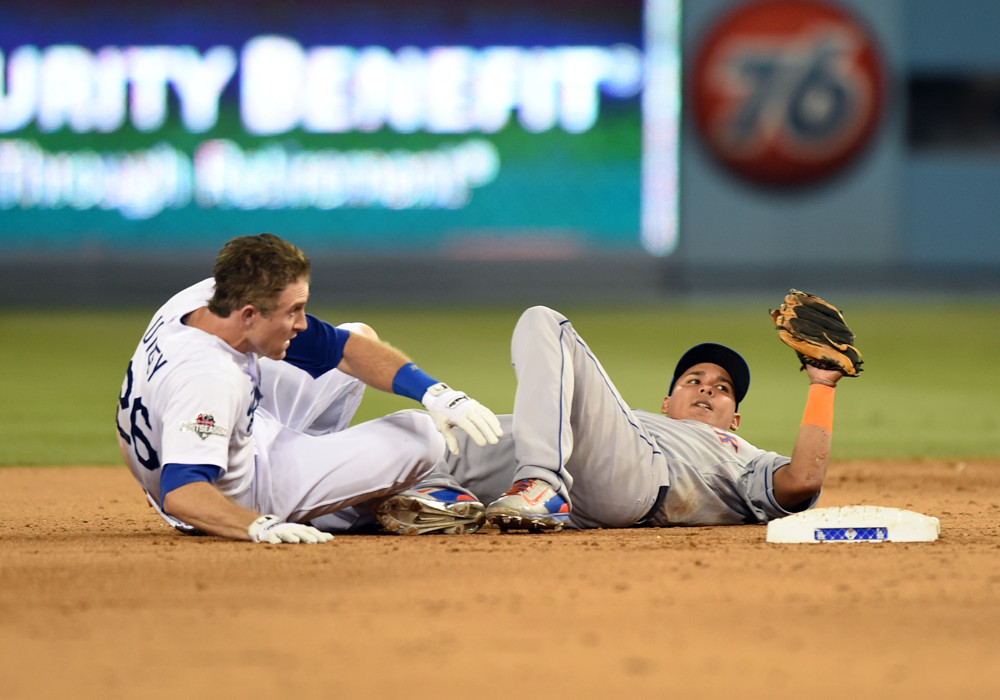 10 October 2015 Los Angeles Dodgers Infield Chase Utley  lies on the ground after colliding with New York Mets Infield Ruben Tejada  during game 2 of the NLDS between the New York Mets and the Los Angeles Dodgers at Dodger Stadium